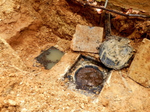 Deposits surrounding a septic pump before cleanup in Pike County