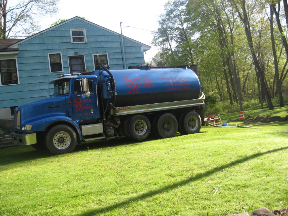 Septic Medic truck parked at a Pennsylvania home to perform septic tank maintenance